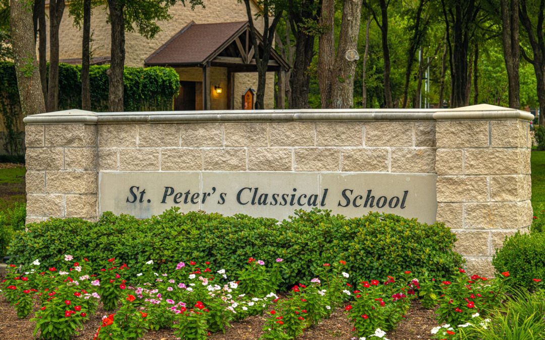 St. Peter's school sign with flowers in front